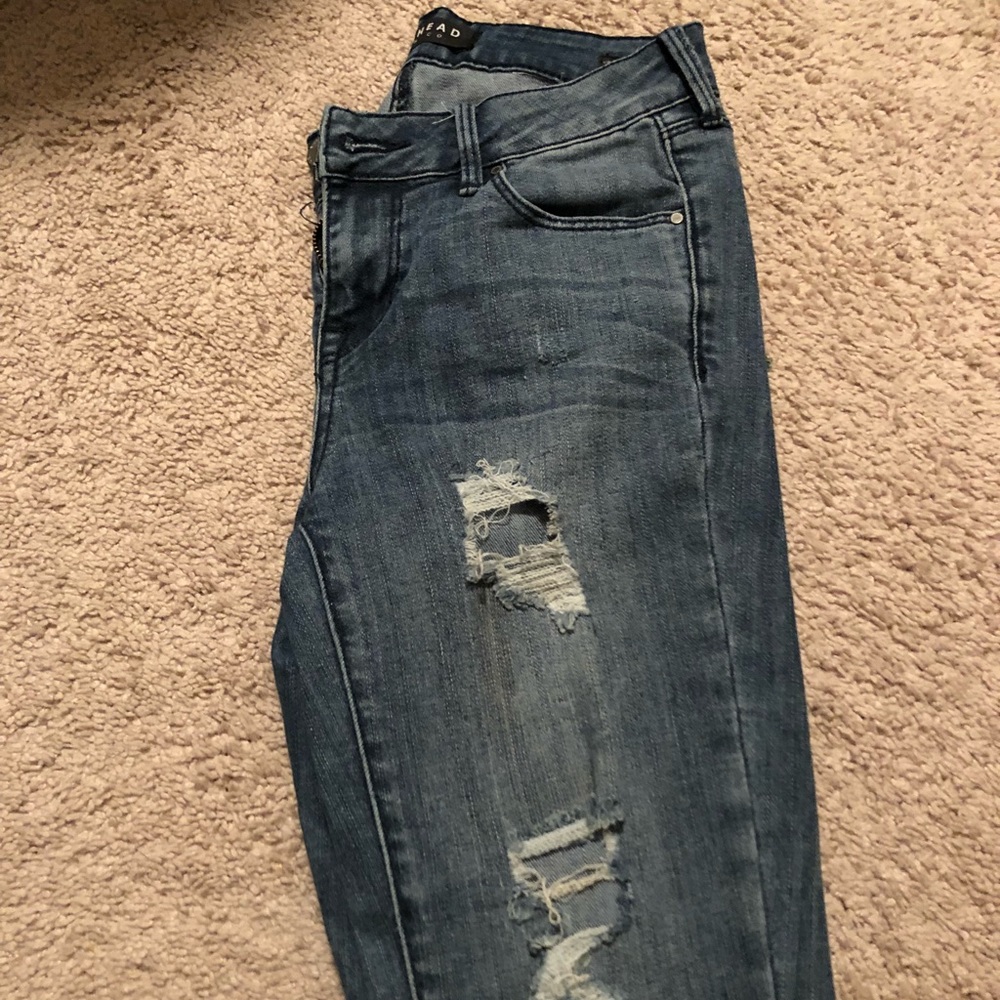 PAC SUN RIPPED JEANS SIZE 24